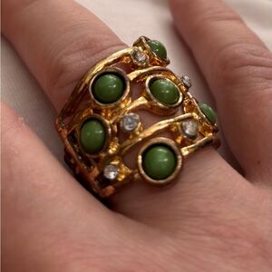 Gold tone and Green stone elastic ring.